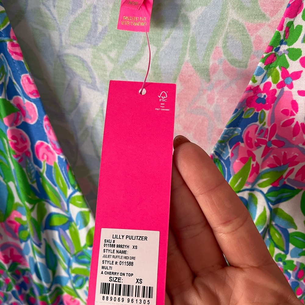 Beautiful colorful Lilly Pulitzer midi faux wrap dress w flutter sleeves.